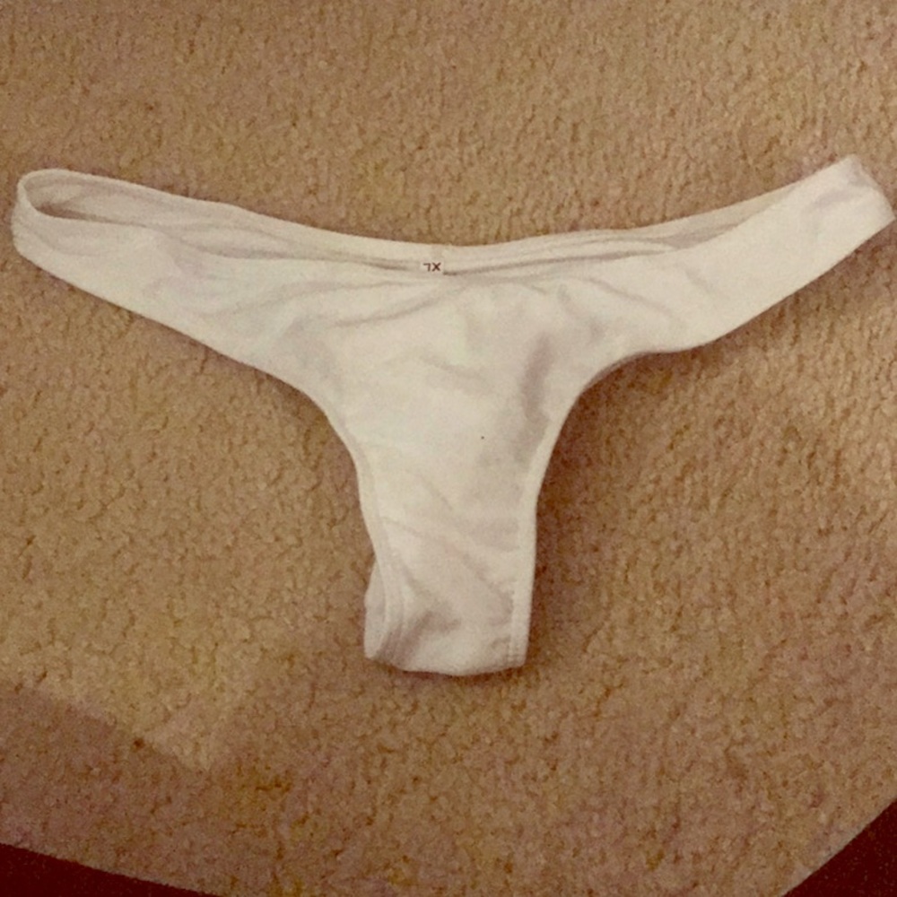 White swim bottom thong *never worn *fits like M/L